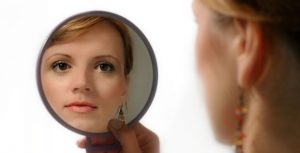 woman-looking-in-mirror